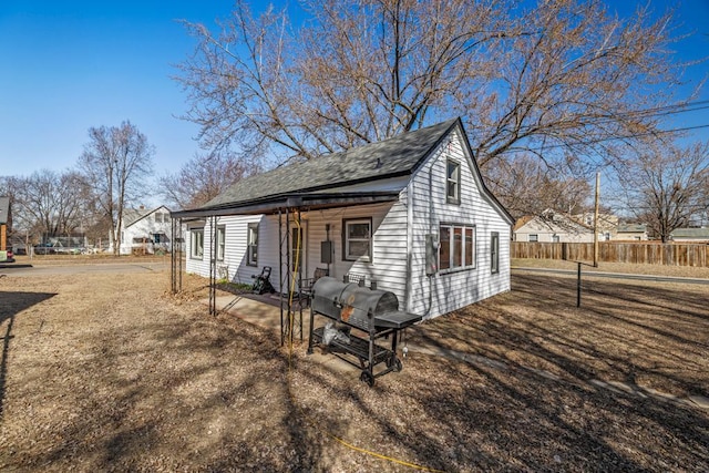 4959 5th St NE, Columbia Heights, MN 55421 - view of side of home with fence and a shingled roof