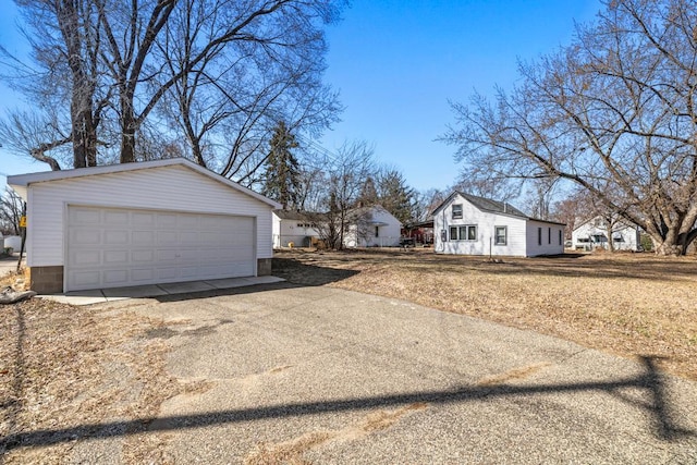 4959 5th St NE, Columbia Heights, MN 55421 - view of home's exterior with an outdoor structure and a garage