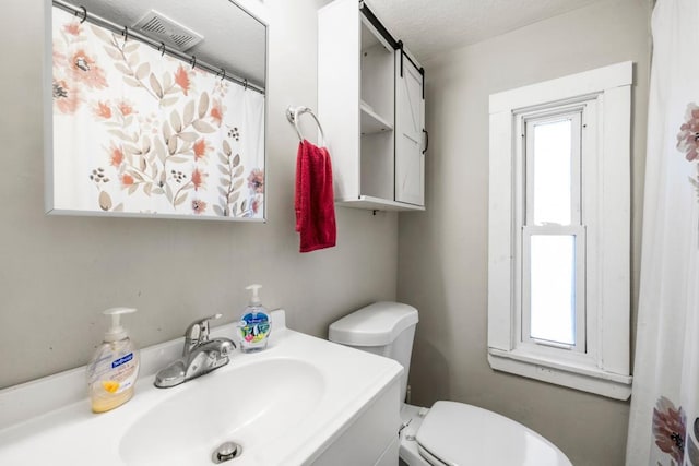 4959 5th St NE, Columbia Heights, MN 55421 - full bathroom featuring healthy amount of natural light, toilet, and vanity