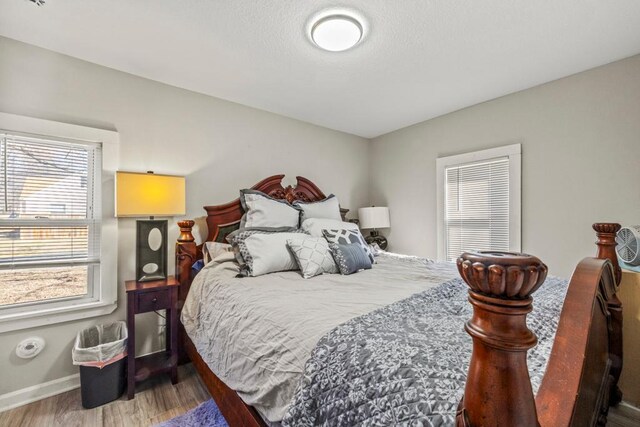 4959 5th St NE, Columbia Heights, MN 55421 - bedroom with wood finished floors and baseboards