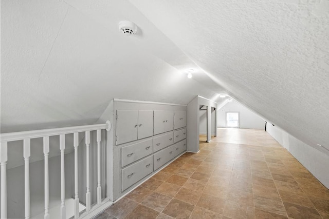4959 5th St NE, Columbia Heights, MN 55421 - bonus room featuring a textured ceiling and lofted ceiling