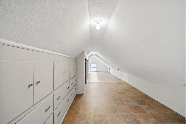 4959 5th St NE, Columbia Heights, MN 55421 - additional living space featuring a textured ceiling and lofted ceiling