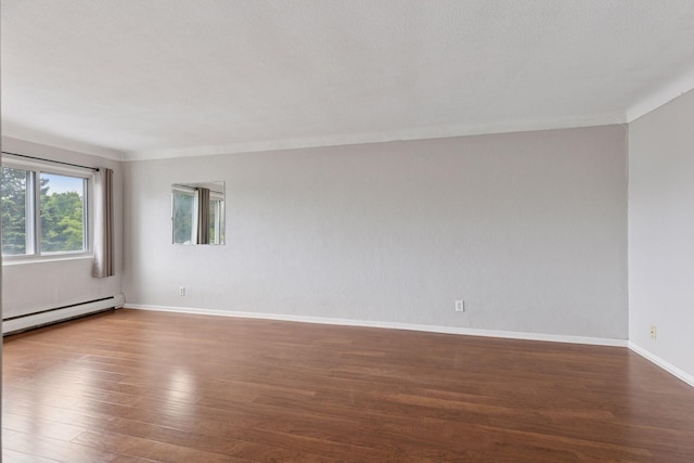 1540 Ashland Ave Unit 3, Saint Paul, MN 55104 - empty room featuring baseboard heating, wood finished floors, and baseboards