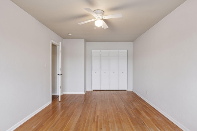 1540 Ashland Ave Unit 3, Saint Paul, MN 55104 - unfurnished bedroom featuring baseboards, light wood-type flooring, a closet, and ceiling fan