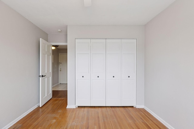 1540 Ashland Ave Unit 3, Saint Paul, MN 55104 - unfurnished bedroom with light wood-type flooring, baseboards, and a closet
