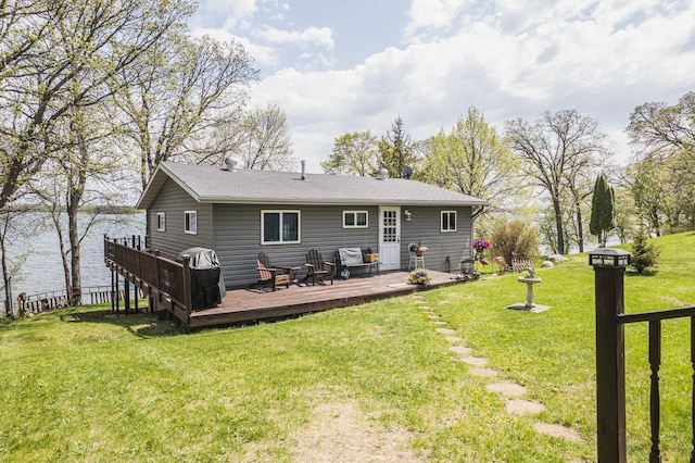 46568 Poss Beach Rd, Dunn Twp, MN 56572 - rear view of house featuring a wooden deck and a yard