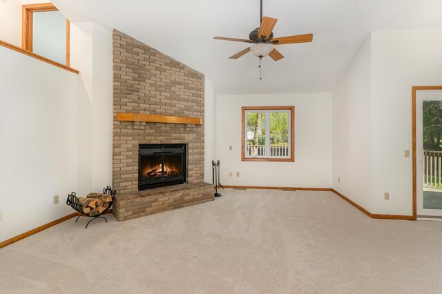 12761 Ethelton Way, Apple Valley, MN 55124 - unfurnished living room featuring carpet, ceiling fan, lofted ceiling, a brick fireplace, and baseboards