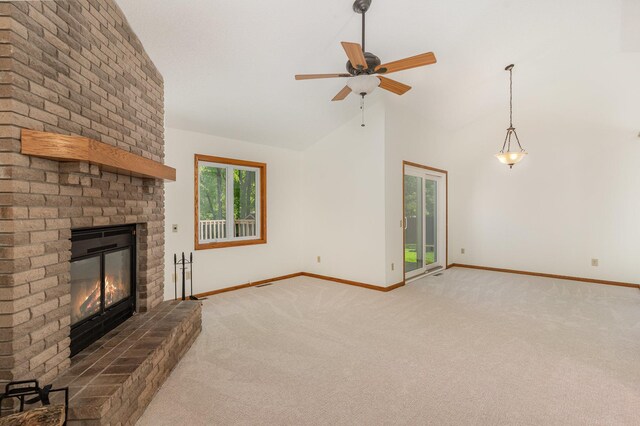 12761 Ethelton Way, Apple Valley, MN 55124 - unfurnished living room featuring light carpet, a fireplace, baseboards, ceiling fan, and high vaulted ceiling