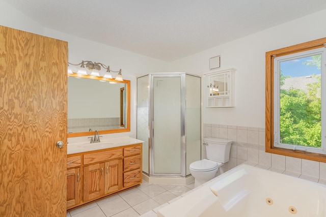 12761 Ethelton Way, Apple Valley, MN 55124 - bathroom with tile patterned floors, a shower stall, toilet, vanity, and a tub with jets
