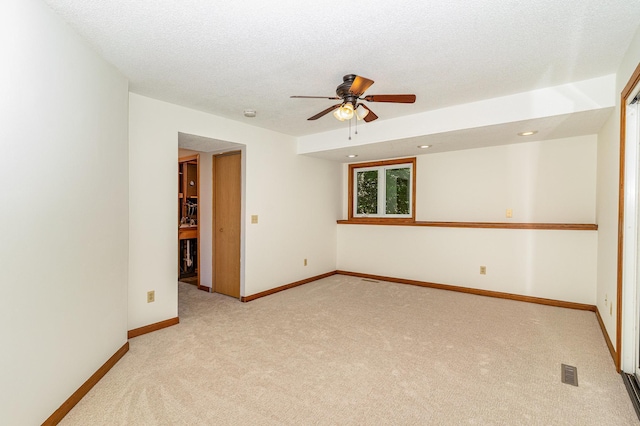 12761 Ethelton Way, Apple Valley, MN 55124 - empty room featuring light colored carpet, a ceiling fan, baseboards, and a textured ceiling