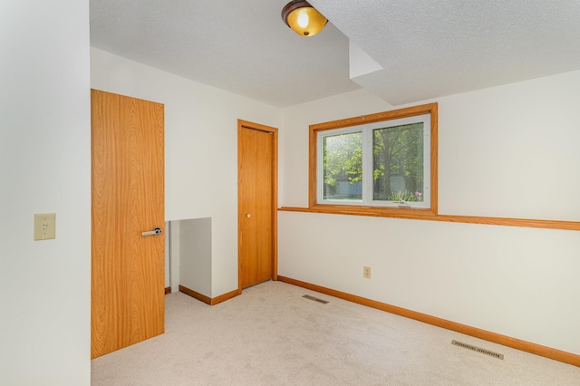 12761 Ethelton Way, Apple Valley, MN 55124 - unfurnished bedroom with carpet, a closet, and baseboards