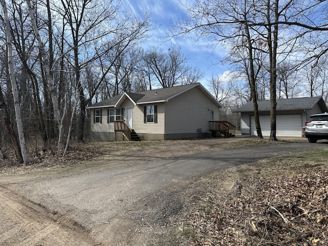 47375 Gone Golfin, Garrison, MN 56450 - view of front of home featuring driveway and a garage