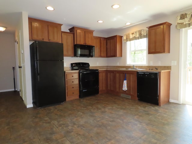 47375 Gone Golfin, Garrison, MN 56450 - kitchen featuring black appliances, light countertops, recessed lighting, and brown cabinets