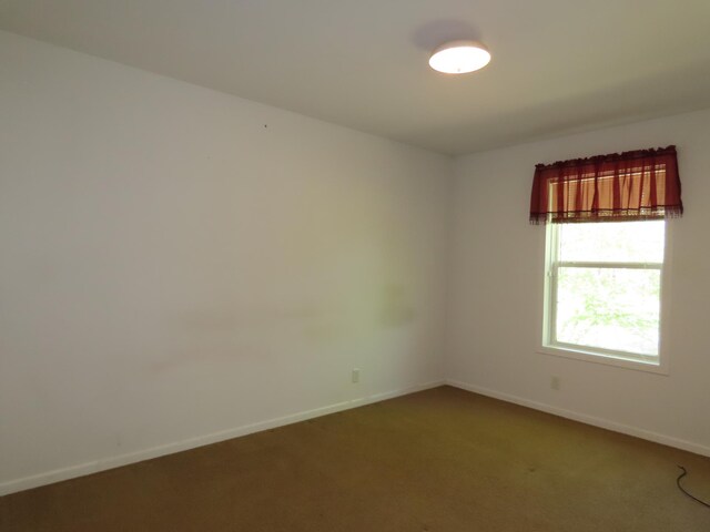 47375 Gone Golfin, Garrison, MN 56450 - spare room featuring carpet and baseboards