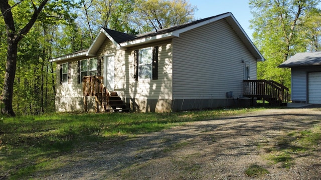 47375 Gone Golfin, Garrison, MN 56450 - view of side of home with a garage