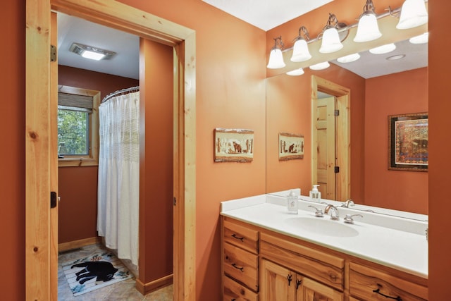 41849 Birchwood Dr, Emily, MN 56447 - full bathroom with vanity, curtained shower, and baseboards