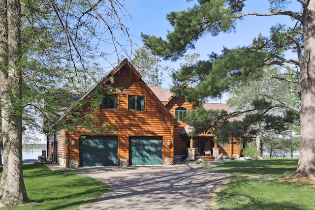 41849 Birchwood Dr, Emily, MN 56447 - view of side of home with a garage, driveway, a lawn, and stone siding