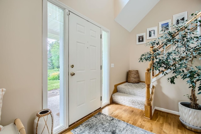 18046 Zodiac St NE, Columbus, MN 55025 - entryway featuring wood finished floors, stairs, and vaulted ceiling
