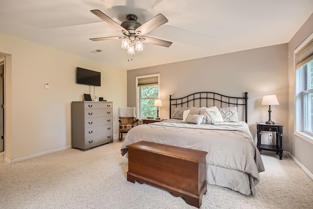 18046 Zodiac St NE, Columbus, MN 55025 - carpeted bedroom with multiple windows, baseboards, and ceiling fan