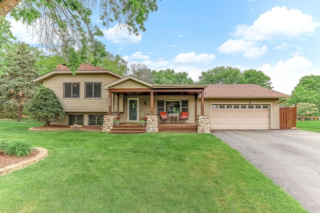 14308 Park Ave, Burnsville, MN 55337 - tri-level home featuring driveway, a porch, a garage, and roof with shingles