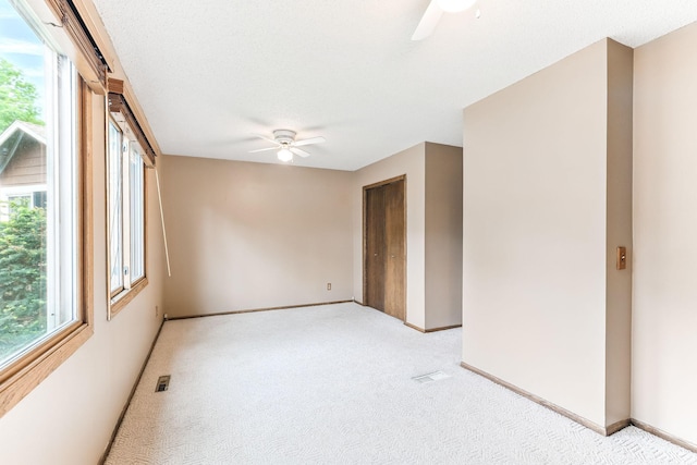 14308 Park Ave, Burnsville, MN 55337 - spare room with ceiling fan, light colored carpet, and baseboards