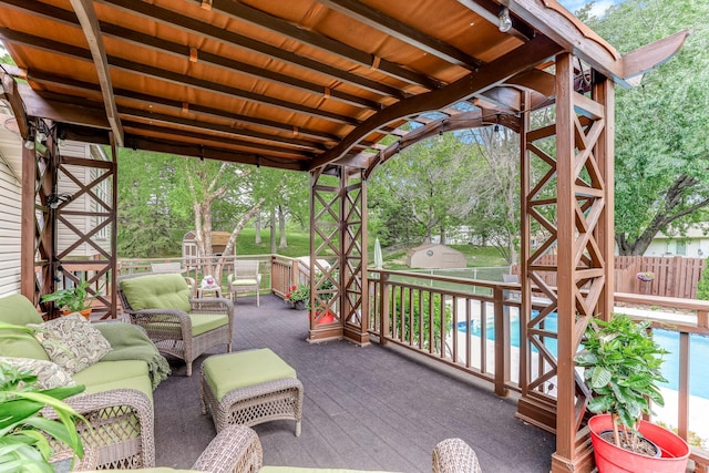 14308 Park Ave, Burnsville, MN 55337 - view of patio / terrace featuring a shed, a fenced backyard, an outdoor hangout area, and an outdoor structure