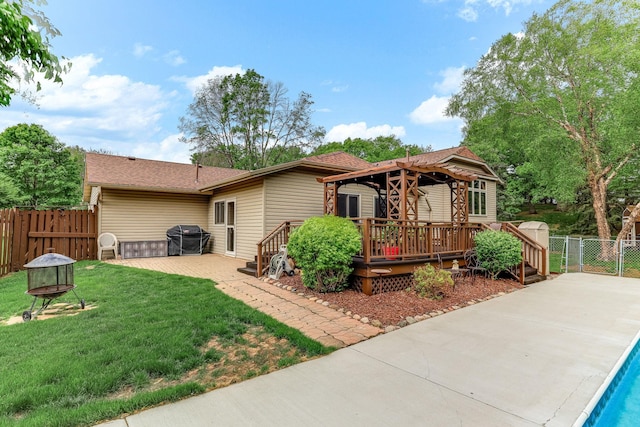 14308 Park Ave, Burnsville, MN 55337 - view of front of home featuring a deck, a gazebo, a patio area, an outdoor pool, and a gate