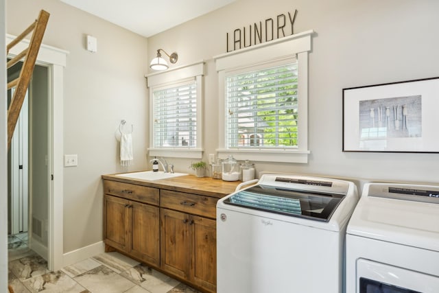 6024 Ojibwa Rd, Brainerd, MN 56401 - laundry room featuring separate washer and dryer and light marble finish floors