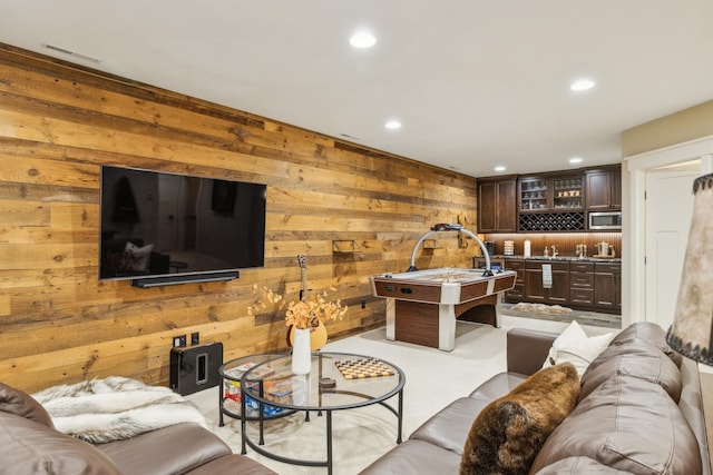 6024 Ojibwa Rd, Brainerd, MN 56401 - living room with wood walls, recessed lighting, and wet bar