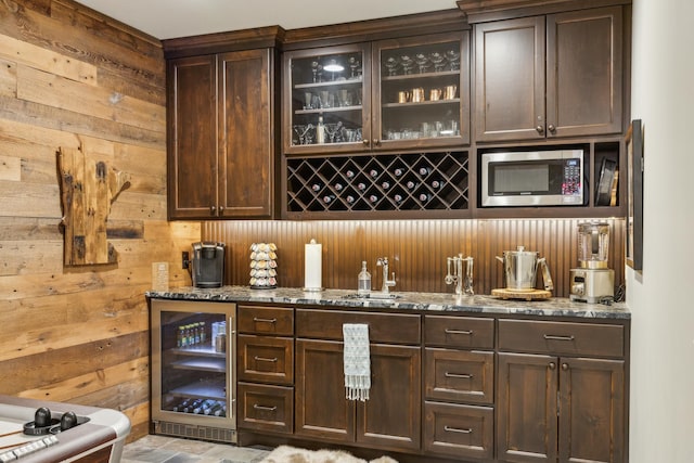 6024 Ojibwa Rd, Brainerd, MN 56401 - indoor bar featuring wine cooler, stainless steel microwave, and wooden walls