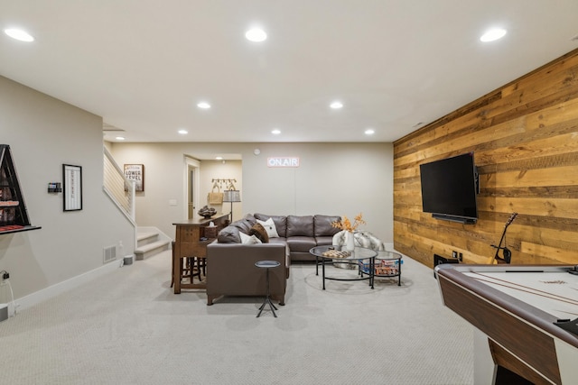 6024 Ojibwa Rd, Brainerd, MN 56401 - living room featuring wood walls, recessed lighting, light colored carpet, stairs, and baseboards