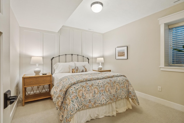 6024 Ojibwa Rd, Brainerd, MN 56401 - bedroom featuring carpet, baseboards, and a decorative wall