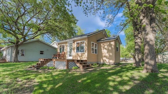 13749 169th Ave, Villard, MN 56385 - back of house featuring stairs, a deck, a yard, and metal roof