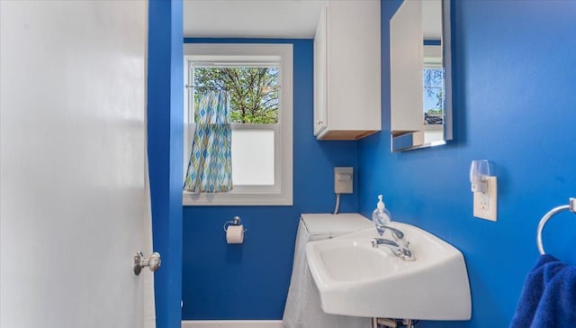 13749 169th Ave, Villard, MN 56385 - half bath featuring a sink and baseboards