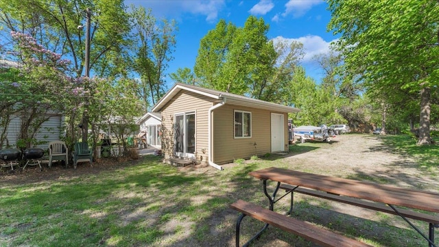 13749 169th Ave, Villard, MN 56385 - rear view of property featuring a lawn and entry steps