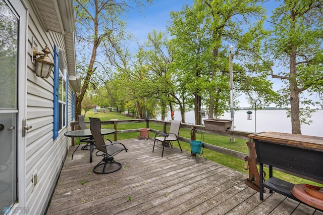 45642 Devils Lake Rd, Edna Twp, MN 56573 - wooden terrace featuring a yard and a water view