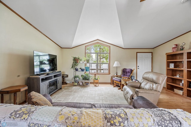 45642 Devils Lake Rd, Edna Twp, MN 56573 - living area featuring wood finished floors, a glass covered fireplace, lofted ceiling, and ornamental molding