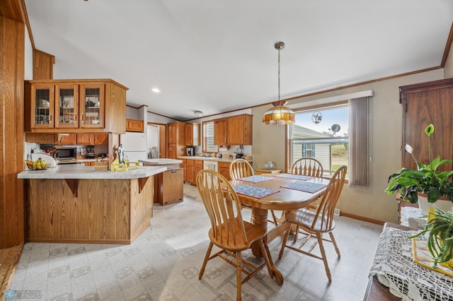 45642 Devils Lake Rd, Edna Twp, MN 56573 - dining area with plenty of natural light, lofted ceiling, light flooring, crown molding, and baseboards