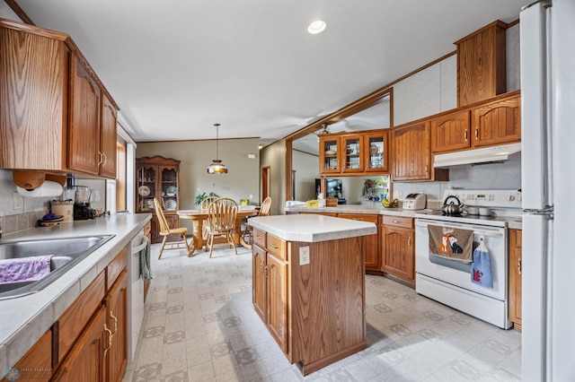 45642 Devils Lake Rd, Edna Twp, MN 56573 - kitchen featuring white appliances, under cabinet range hood, light flooring, a kitchen island, and a sink