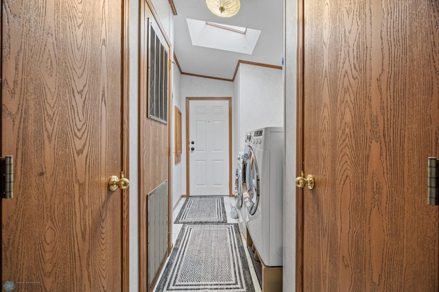 45642 Devils Lake Rd, Edna Twp, MN 56573 - clothes washing area with a skylight, crown molding, and washing machine and dryer
