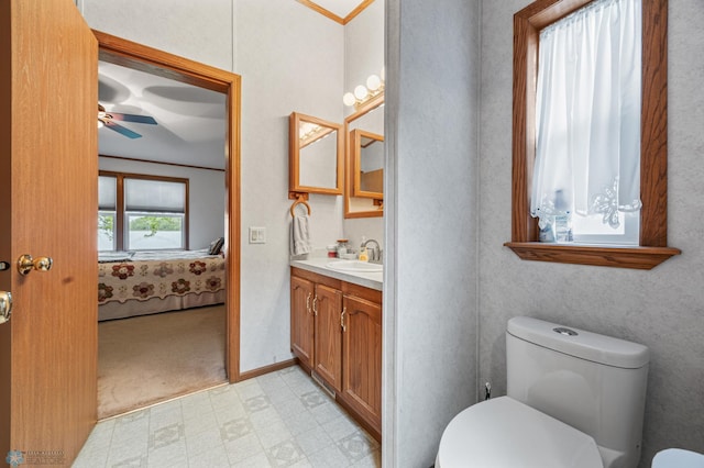 45642 Devils Lake Rd, Edna Twp, MN 56573 - ensuite bathroom featuring toilet, a ceiling fan, tile patterned floors, and vanity