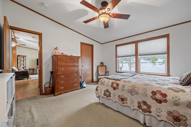 45642 Devils Lake Rd, Edna Twp, MN 56573 - bedroom with ornamental molding, lofted ceiling, light colored carpet, ceiling fan, and a closet