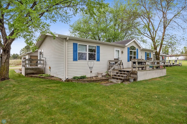 45642 Devils Lake Rd, Edna Twp, MN 56573 - view of front of house with a wooden deck and a front yard