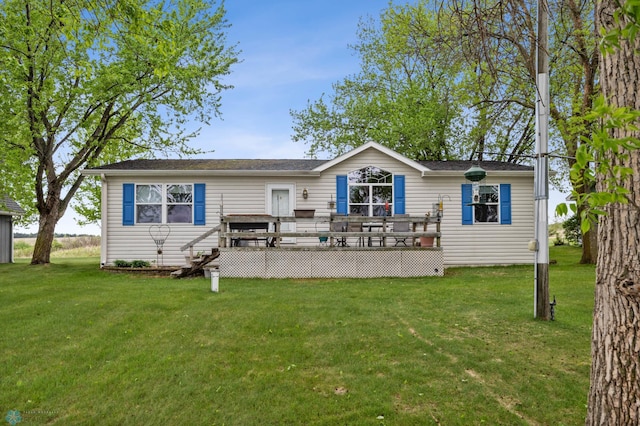 45642 Devils Lake Rd, Edna Twp, MN 56573 - back of property with a deck and a yard