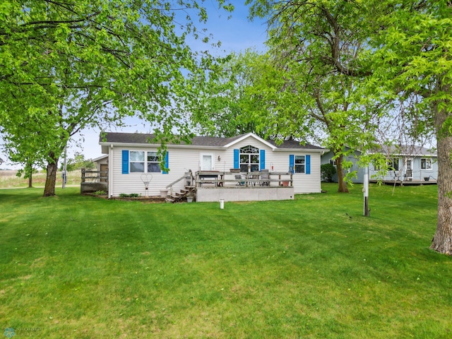 45642 Devils Lake Rd, Edna Twp, MN 56573 - back of property featuring a wooden deck and a lawn