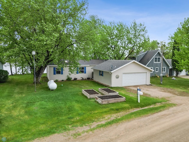 45642 Devils Lake Rd, Edna Twp, MN 56573 - view of front facade featuring driveway, a front lawn, and a shingled roof