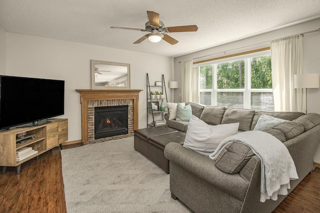 4132 Oakbrooke Curv, Eagan, MN 55122 - living area featuring a ceiling fan, wood finished floors, a fireplace, and a textured ceiling