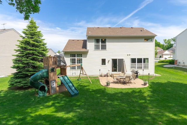 4132 Oakbrooke Curv, Eagan, MN 55122 - back of property with a patio area, a lawn, and a playground