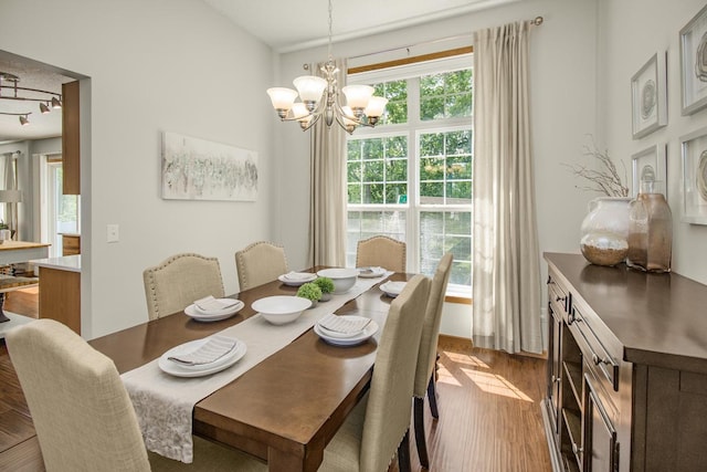 4132 Oakbrooke Curv, Eagan, MN 55122 - dining room featuring wood finished floors and a chandelier