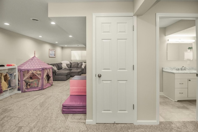 4132 Oakbrooke Curv, Eagan, MN 55122 - rec room with light colored carpet, recessed lighting, baseboards, and a sink